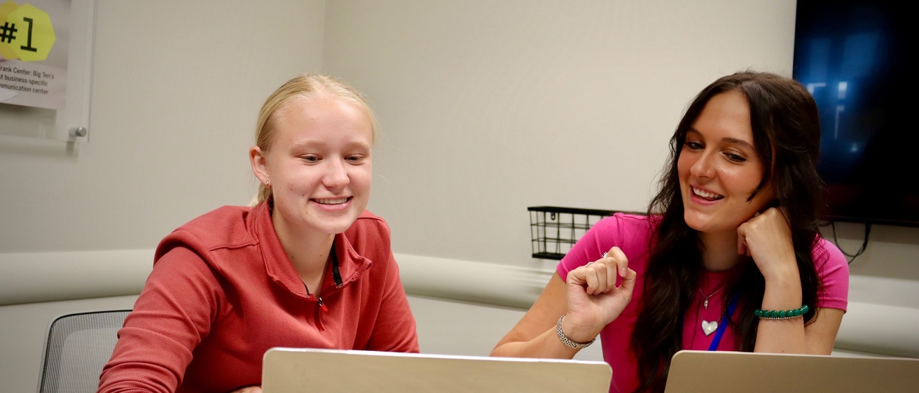 Photo of one student tutoring another